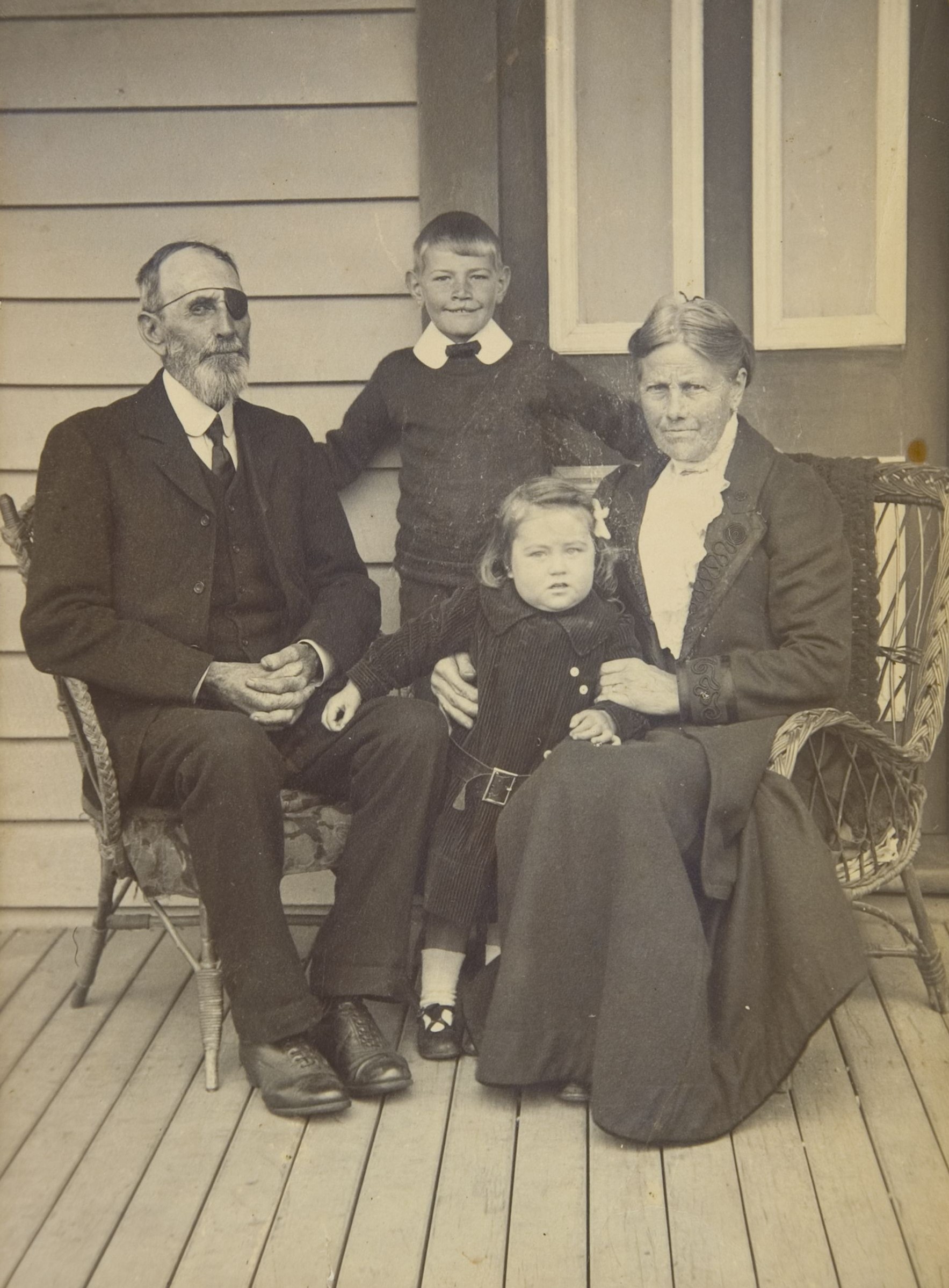 William Johnston and his wife Jane with their grandchildren Neil and Nelly (1910s). Unknown photographer. Collection of Puke Ariki (PHO2005-173).