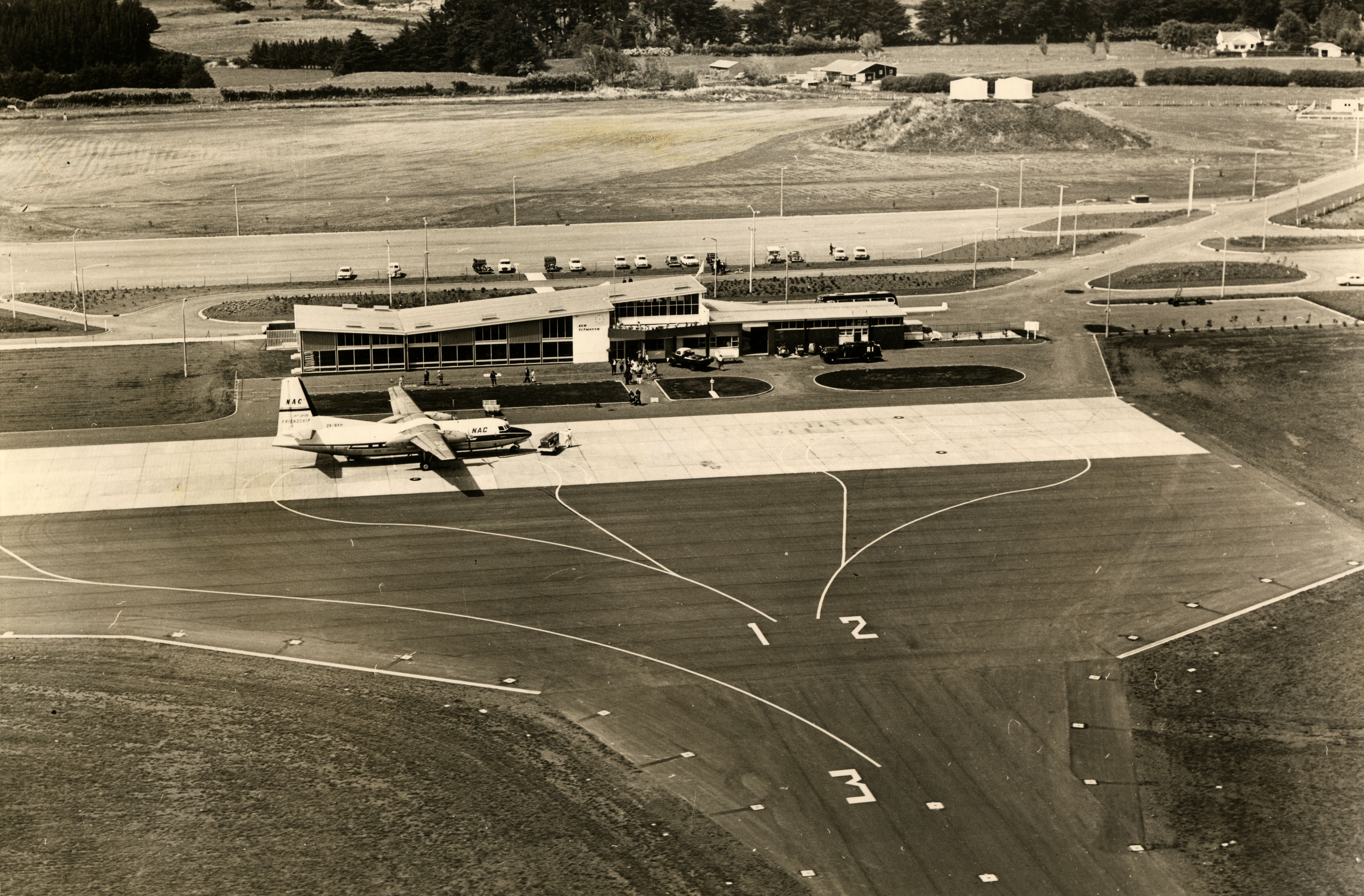 New Plymouth Airport after its official opening in 1966 with Brown Road in the background. Unknown photographer. Collection of Puke Ariki (PHO2014-0203).