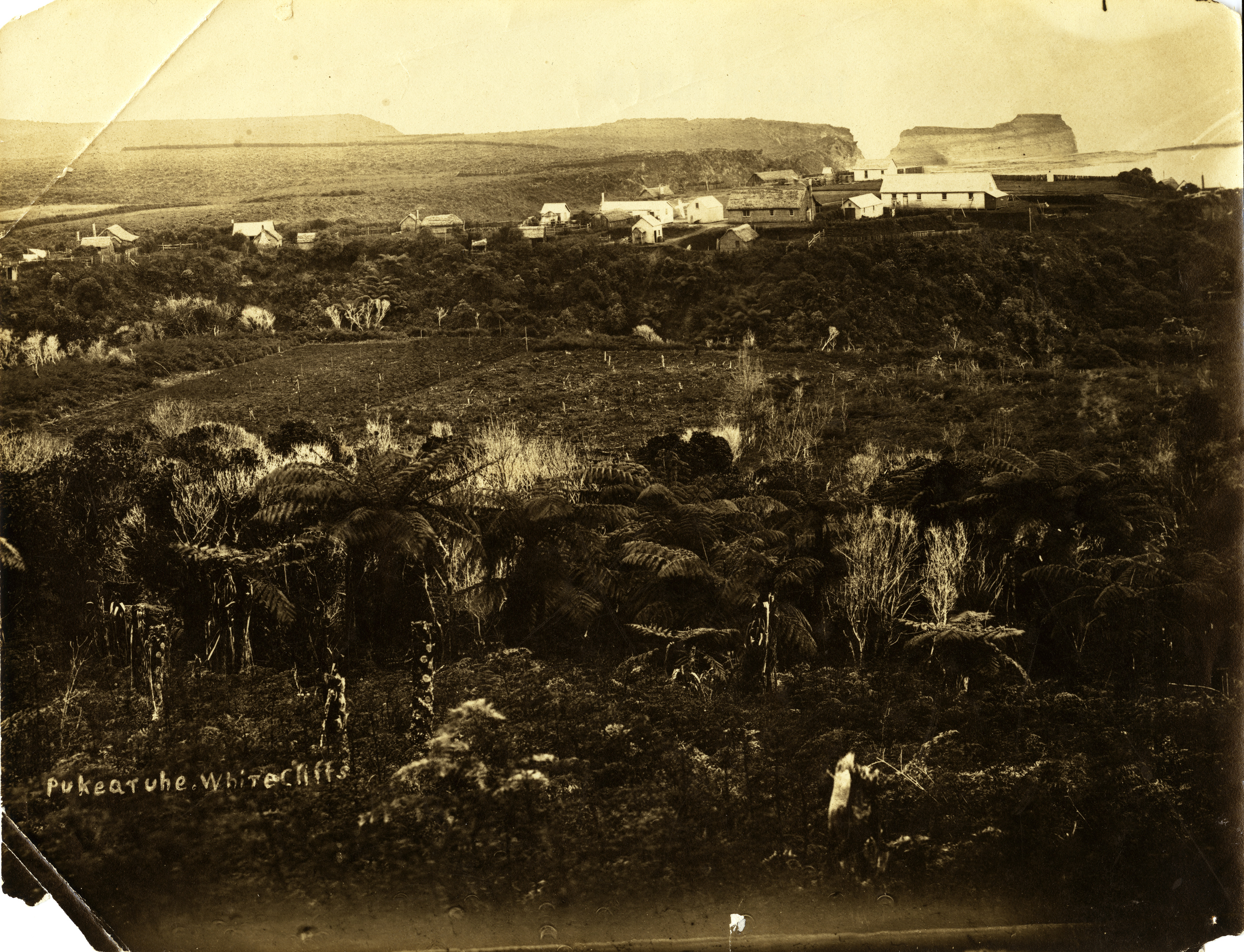 Pukearuhe Redoubt with the spot where Reverend John Whiteley was killed marked by a cross (1869). Unknown photographer. Collection of Puke Ariki (PHO2007-238).