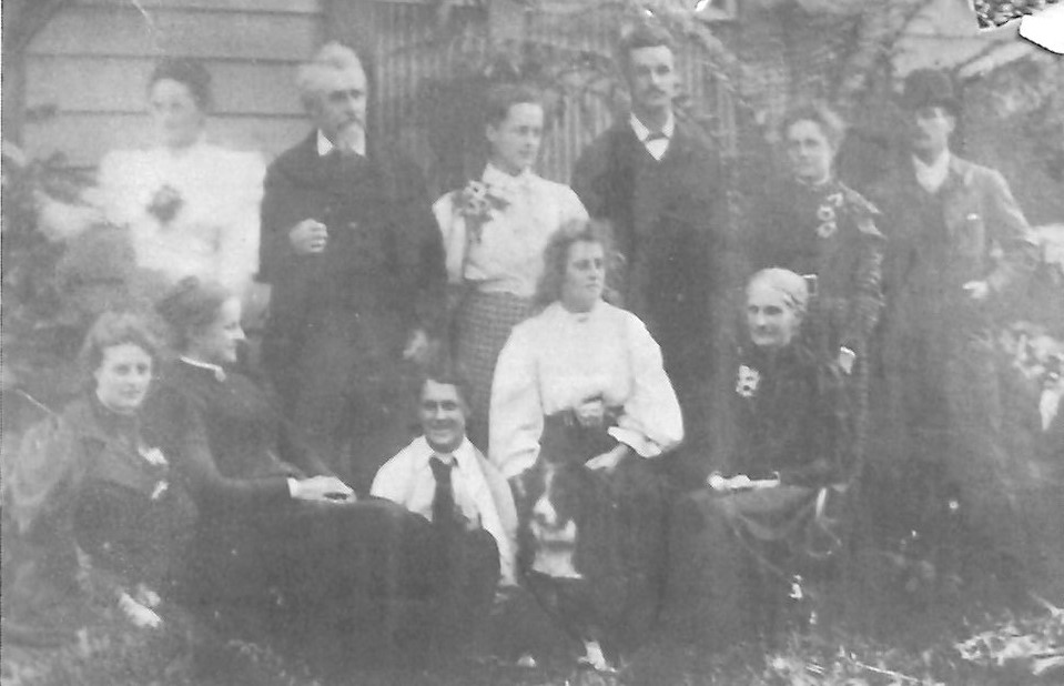 Group portrait of the Batten family with Hamilton in the middle of the back row. Image courtesy of Ross Dunlop from the book "Taranaki Stories" by Rhonda Bartle and Sorrel Hoskin (2006).