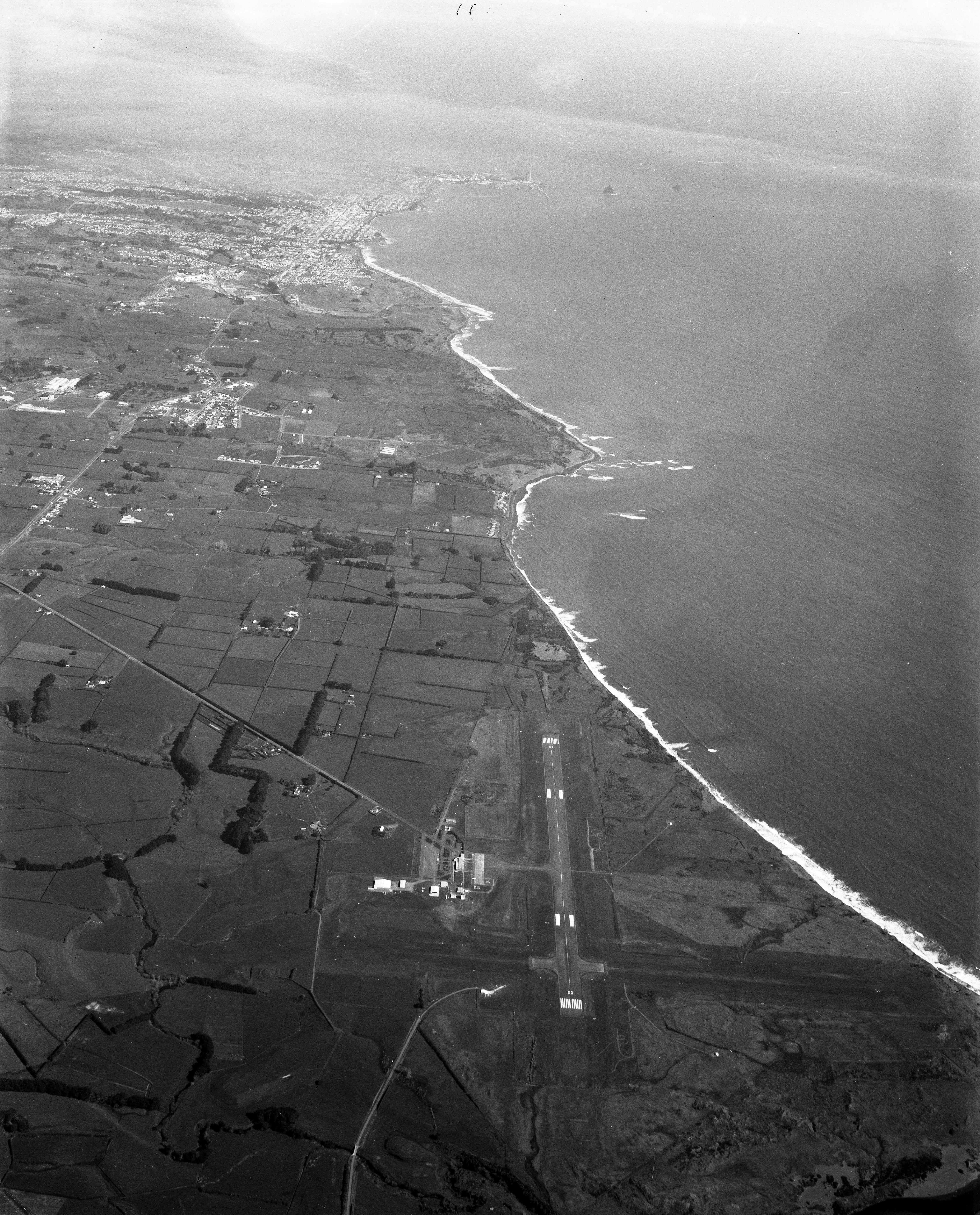 Aerial view of New Plymouth Airport (August 1973). Charters and Guthrie Associates Ltd. Collection of Puke Ariki (PHO2012-0283).