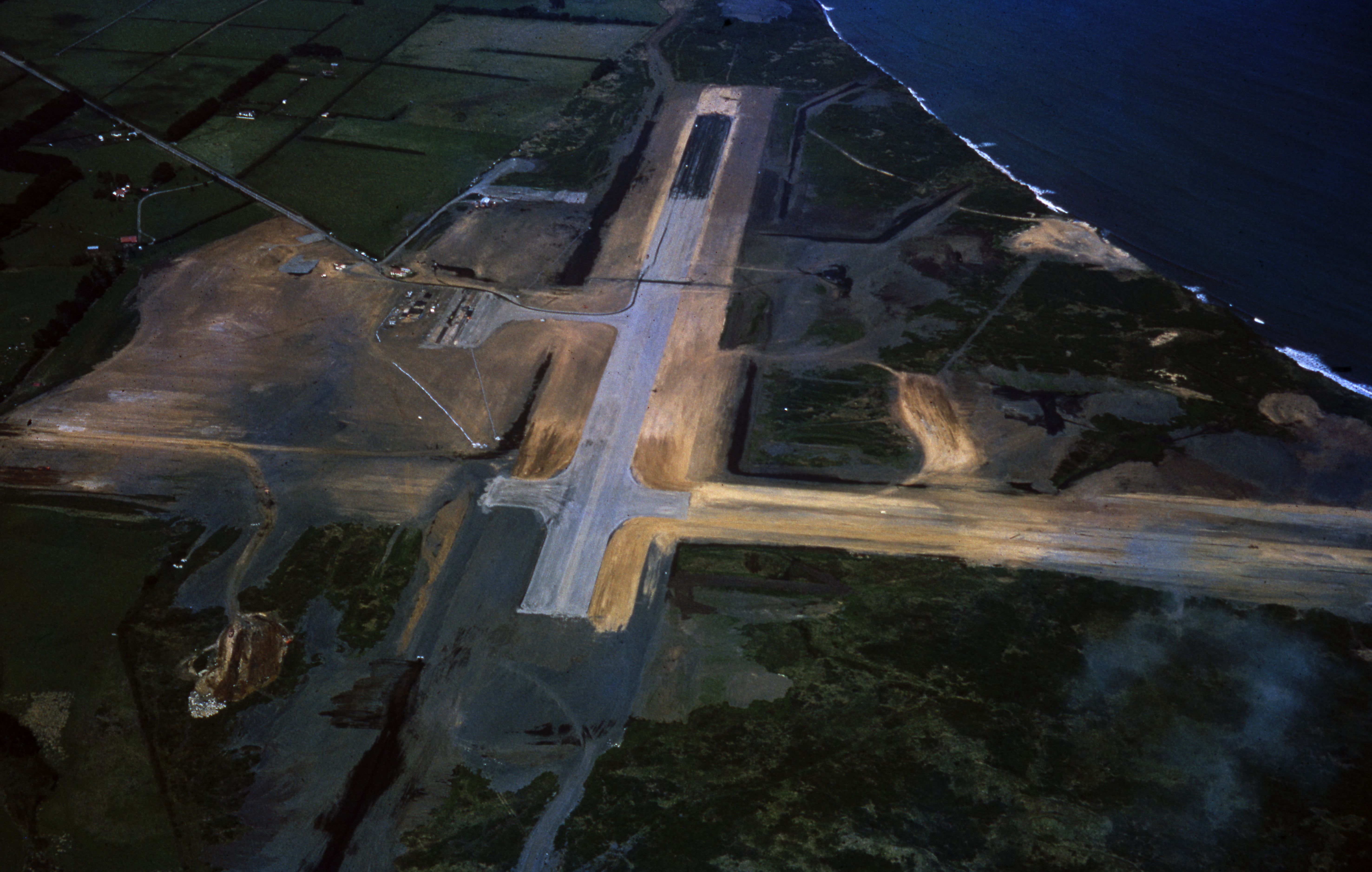 New Plymouth airport under construction in the 1960s with Brown Road on the left. Leslie Alexander Smith. Collection of Puke Ariki (PHO2015-0132).
